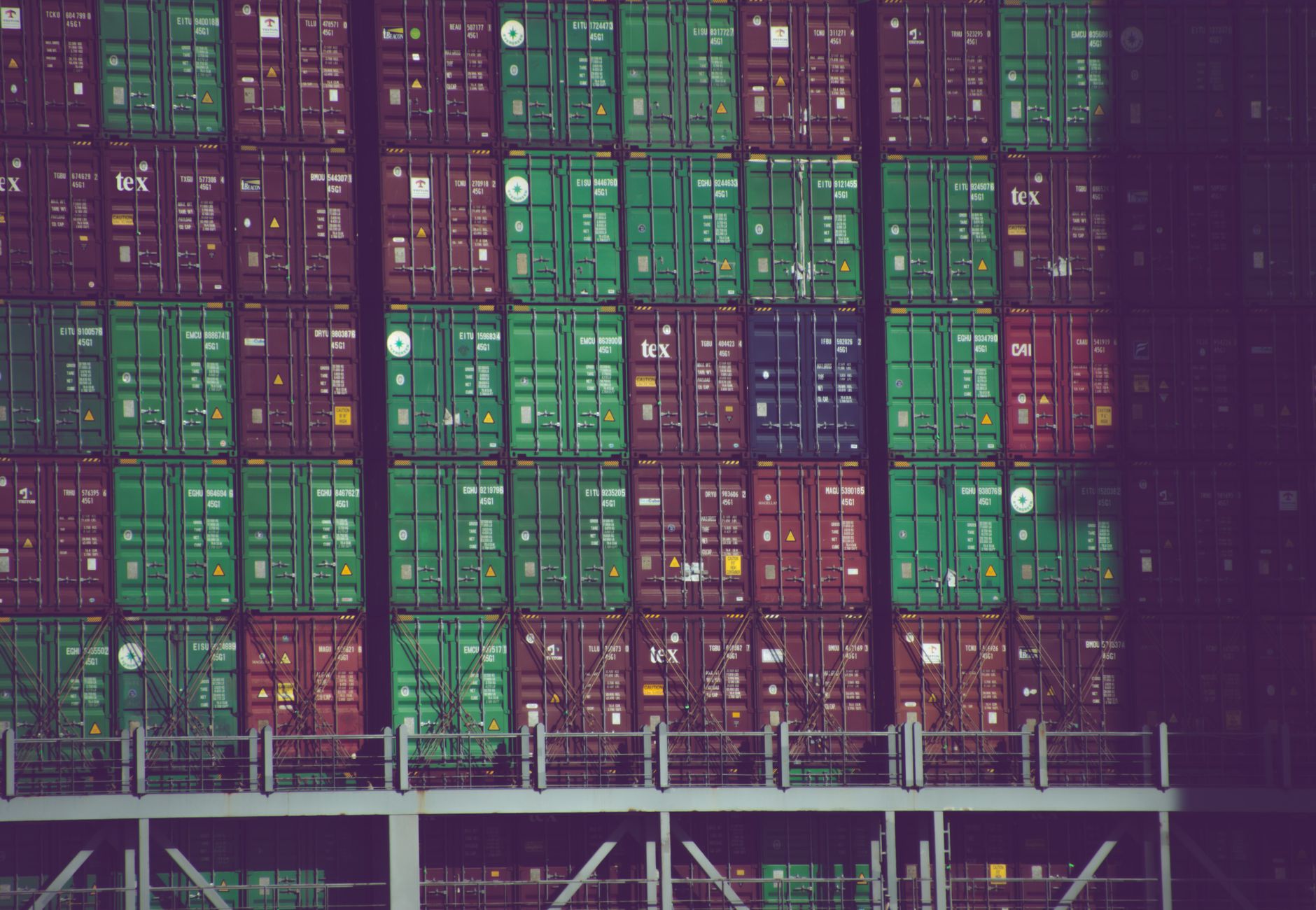 Vibrant cargo containers stacked at Hamburg port, Germany, showcasing global trade.